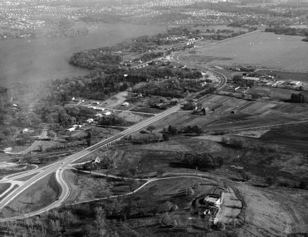 Aerial view of the southeast, with West Broadway and the South Beltline running through the image. Also shows Nob Hill restaurant, the Toki family farm and site of the old Royal Airport.
