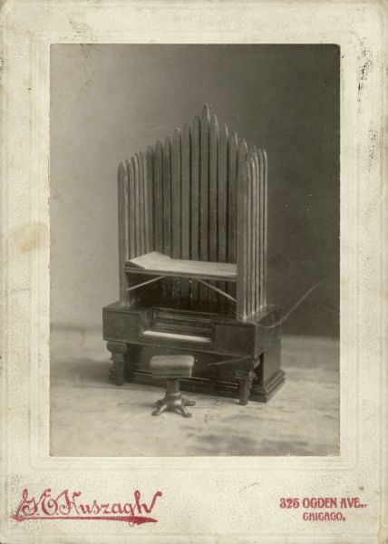 Studio photograph of a model or prototype of a pipe organ. Original caption reads: "organ from the collection of James Lowth, inventor."