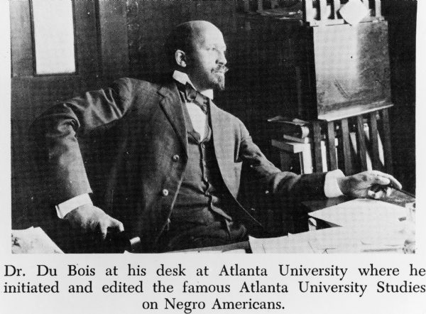 Dr. DuBois seated at his desk at Atlanta University where he initiated and edited the Atlanta University Studies on Negro Americans.