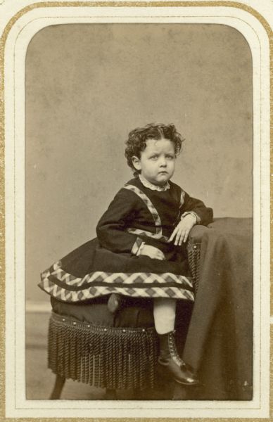 Carte-de-visite portrait of Grace Clark Conover, the daughter of Darwin Clark and the wife of Frederic Conover, pictured here as a young girl wearing a short dress.