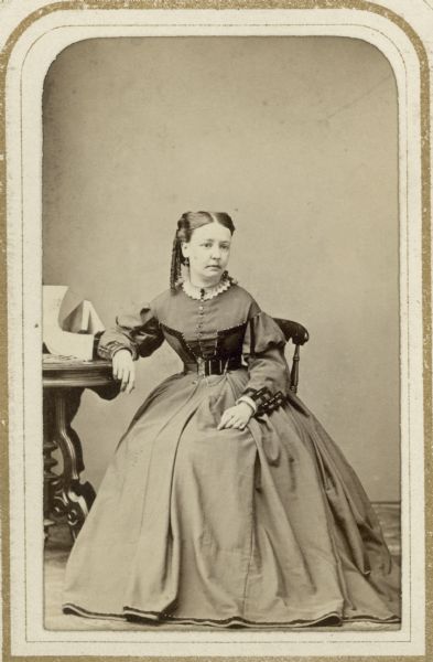 Seated carte-de-visite portrait of Madison resident Helen R. Adams, the second wife of La Fayette Kellogg and the sister of Frances Adams Clark, the wife of Darwin Clark.