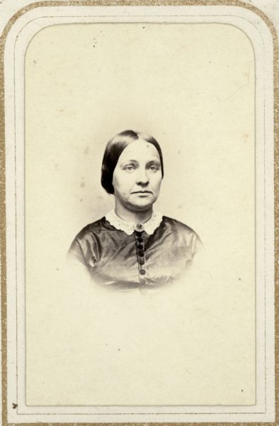 Head and shoulders carte-de-visite portrait of Sophia Goodnow Dunning of Madison, Wisconsin, the wife of pharmacist Philo Dunning and the mother of Mrs. Edwin Sumner. She was also the sister of Sarah, the second wife of Darwin Clark.