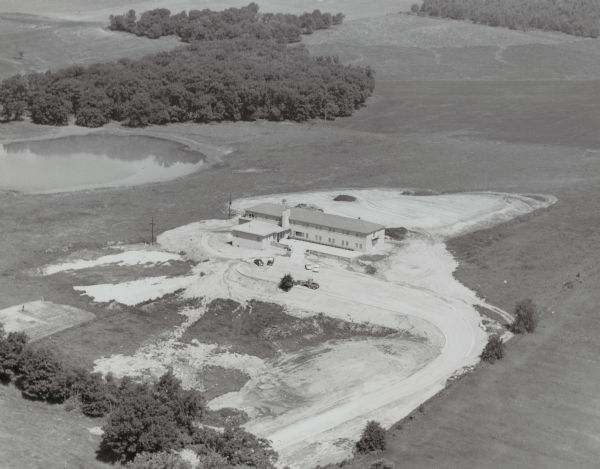 Aerial view of St. Benedict's convent, mother house, novitiate on the north shore of Lake Mendota (aka Fox Bluff), built in 1953.  From 1959 - 1966 it was also a college prep high school for girls. The building was expanded in 1960. The facility became the St. Benedict Conference Center until 2004. In 2006 it ended its ties to the Roman Catholic Church and is now called Holy Wisdom Monastery.