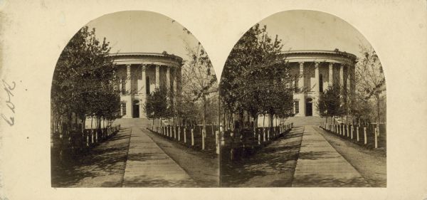 Stereograph view of the East Wing of the 2nd Wisconsin State Capitol built in Madison, also showing the pathway to the door then considered to be the front door. and trees in the Capitol Park. No identical view is included with Fuller's carte-de-visite format views of Madison.
