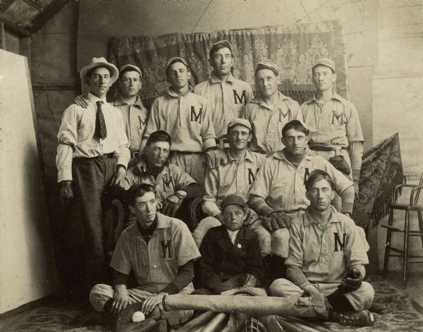 Group portrait of a baseball team with the letter M on their uniforms.