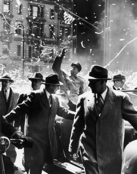 General Douglas MacArthur in the midst of a tickertape parade honoring his return from Korea.