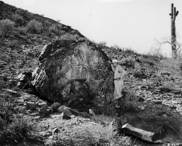 Stone displaying ancient writing. The rock was on the grounds of International Harvester's Phoenix Proving Grounds.  Opened in 1947, the proving ground was used by International Harvester through the 1970's to test trucks and construction equipment under harsh desert conditions.