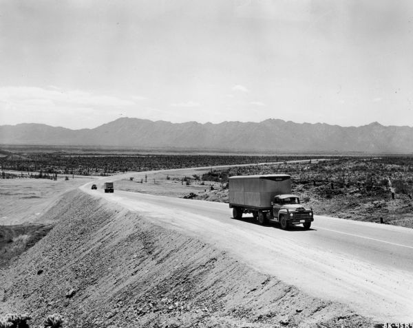 International semi trucks mounting a long hill at International Harvester's Phoenix Proving Ground. Opened in 1947, the proving ground was used by International Harvester through the 1970's to test trucks and construction equipment under harsh desert conditions.
