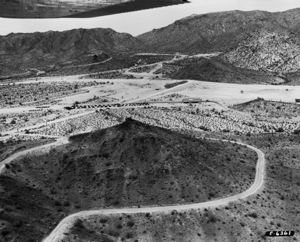 Aerial view of the Phoenix Proving Ground during the 1954 Industrial Power Roundup, a large event promoting International Harvester's construction equipment line. Opened in 1947, the proving ground was used by International Harvester through the 1970's to test trucks and construction equipment under harsh desert conditions.