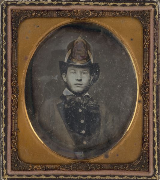 Sixth plate daguerreotype of Frederick Moessner wearing a fireman's hat for Madison Engine Co. No. 2. He was one of the original members of Madison Fire Company No. 2, signing the constitution on June 23, 1856. He last appears on their payrolls (fire fighters got a uniform/supply payment each month) during March 1859.