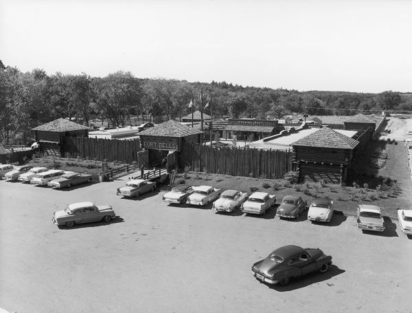 View looking over Fort Dells, with cars parked in the foreground.