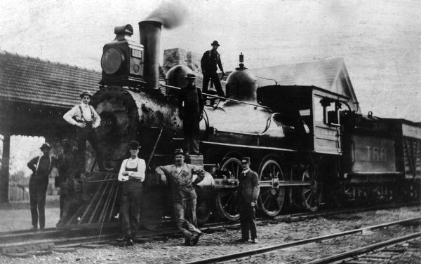 Chicago, Milwaukee and St. Paul Railway locomotive no. 186, a class G-5 built by the Baldwin Locomotive Works in 1892, on service on the La Crosse Division. It was originally numbered 823, re-numbered 186 in 1899, 2234 in 1912, and scrapped in 1926. Engineer P.H. McGann is standing at the cylinder head.