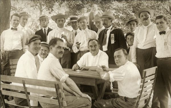 Harry W. Bolens,(seated, center) during an unsucessful campaign for Lieutenant Governor of Wisconsin during the summer of 1912. He was an inventor, obtained patents on chair and furniture fixtures, power garden tractors and lawn mowers. He helped organize the Gilson Manfactoring Co., Bolens-Enders Printing Co., and the Plymouth Phonograph Co., and was one of the founders of the Wisconsin Manufacturers' Association, serving as its president for several years. A conservative Democrat, Bolens was mayor of Port Washington (1906-1908, 1910-1914), and as state senator (1933-1940), was credited with helping to develop the Democratic-Republican coalition opposition to the Wisconsin Progressive Party. He was the unsuccessful Democratic candidate for governor in 1938. He was opposed to organized labor, higher corporate taxes, and public-works programs.