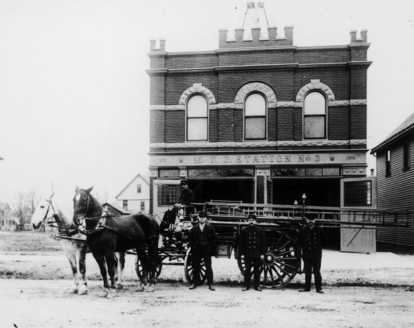 Madison original Fire Station No. 3 (1902-1954), 1217 Williamson St. The driver is Albert Fell. Standing are George Eichman, Ole Johnson, and Ed Heick.