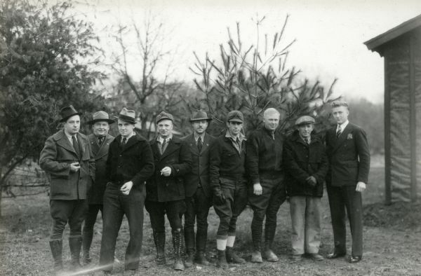 An outdoor portrait of the Technical Service Team at Camp Interstate. From left to right are Kunsman, Hollister, Podolske, Preston, Greaves, Hurd, Solberg, Zenther, and Creich.