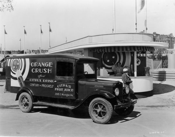 International truck delivering Orange Crush soda to a concession stand at the "A Century of Progress" Worlds Fair. The truck was owned by Citrus Fruit Juice, Inc.