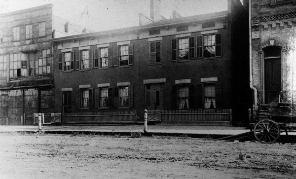 Exterior view of the home of Increase A. Lapham at 321-325 Poplar Street, which was built by J.A. Messenger in 1848.