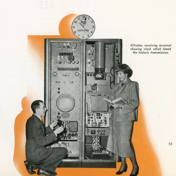 A man and a woman stand by an Ultrafax machine as the first-ever transmission is received.