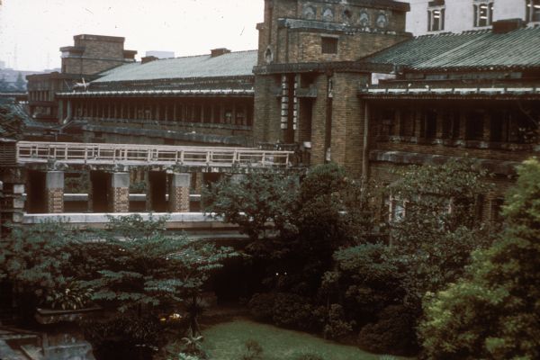 Interior courtyard at the Imperial Hotel, Tokyo, Japan, including one of the guest room wings of the hotel. The hotel was designed by architect Frank Lloyd Wright.