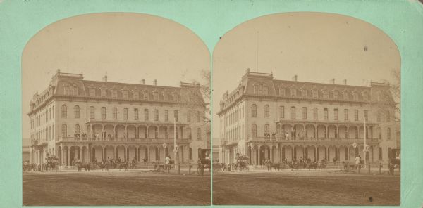 Exterior view of the Park Hotel. Among its fine features are black walnut trim, Brussels carpet, marble-topped furniture, and spring beds. The hotel was one of Madison's earliest first-class hotels and was the first building on the Capitol Square to have water closets.