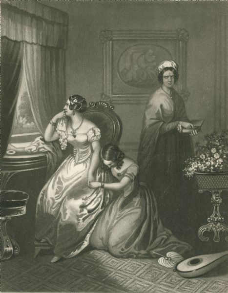 An unhappy looking bride is seated in a chair looking out the window as another woman sits on the floor holding her hand. A third woman looks on angrily.