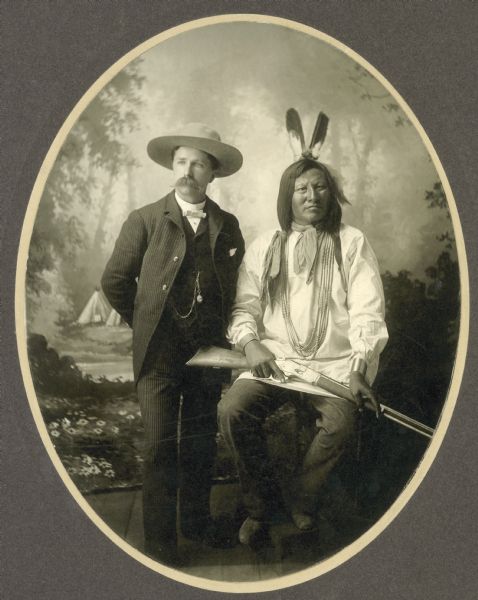 Studio portrait of photographer David Frances Barry and Chief Rain-In-The-Face.