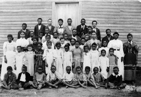 Group portrait of members of the Greene, Shepard, Gadlin, Grimes, and Craig families who lived in the Pleasant Ridge community.