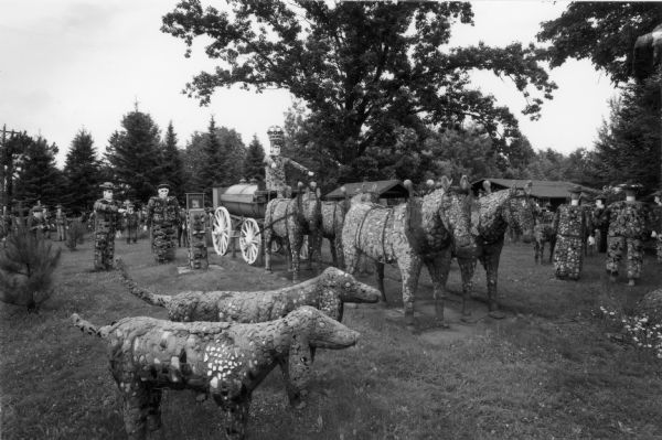 Fred Smith's Concrete Park, including folk art pieces depicting people, dogs and a team of horses.