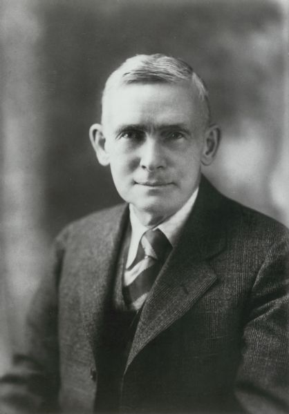 Portrait of photographer Alfred Stanley Johnson, Jr., a Waupun photographer best known for his "tall-tale" or "freak" postcards.