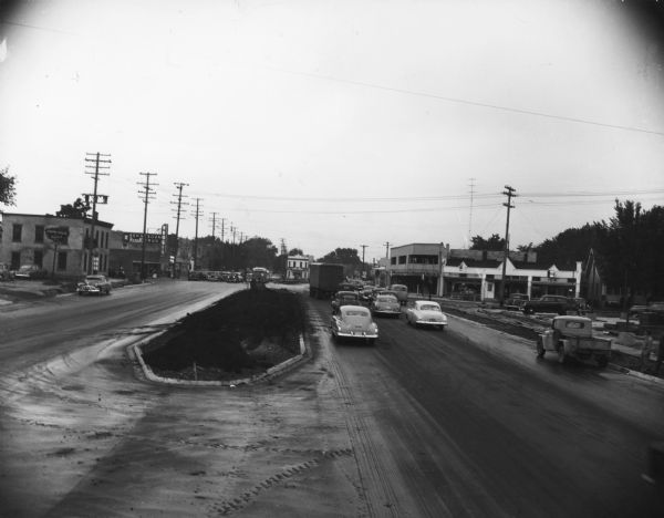 East Washington Avenue near Union Corners when first reopened after widening in 1955. Several vehicles are on the road.