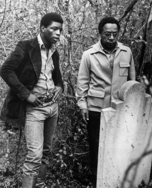 Author Alex Haley and actor LeVar Burton visit the grave of Haley's  ancestor, the slave Kunte Kinte, in Spottsylvania County, Virginia. In the television mini-series made from Haley's best selling book, "Roots," Burton played Kinte.