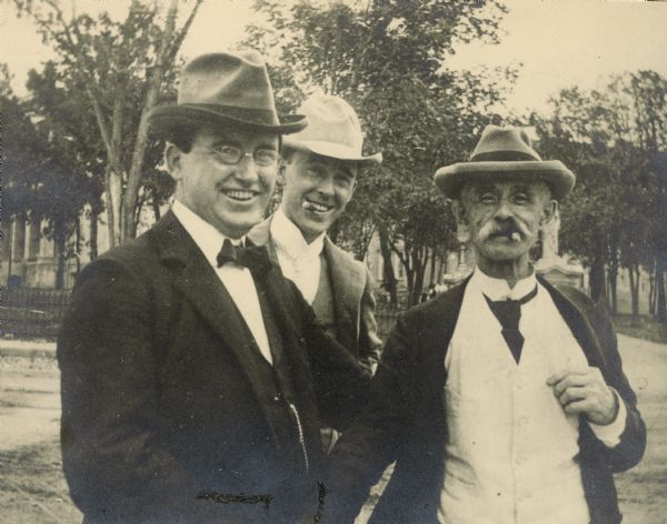 Russell Jackson (?), Joseph W. Jackson, and Dr. James A. Jackson, Sr., (with cigar), in front of the Wisconsin State Capitol.