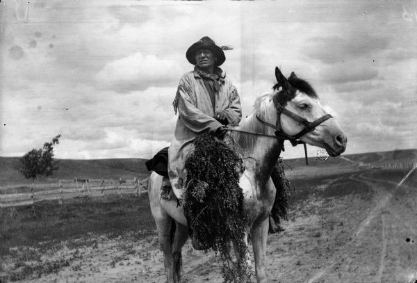 Portrait of Native American on horseback.  A similar photograph that appeared in the Williston Press, January 11, 1951, dated it as 1902.