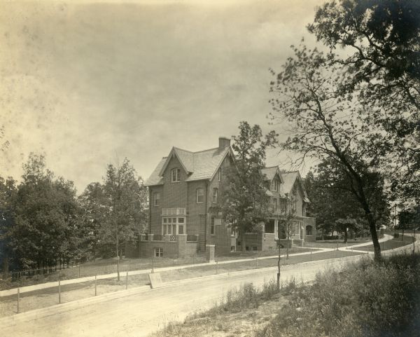 Exterior view of the John M. Olin House, 130 North Prospect Avenue, in the University Heights neighborhood. The house, which displays traditional Gothic architecture, was designed by the architectural firm of Ferry & Clas, and is the home of the Chancellor of the University of Wisconsin-Madison.