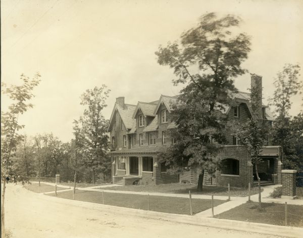 Exterior view of the John M. Olin House, 130 North Prospect Avenue, in the University Heights neighborhood. The house, which displays traditional Gothic lines and was designed by the architectural firm of Ferry & Clas, is the home of the chancellor of the University of Wisconsin-Madison.