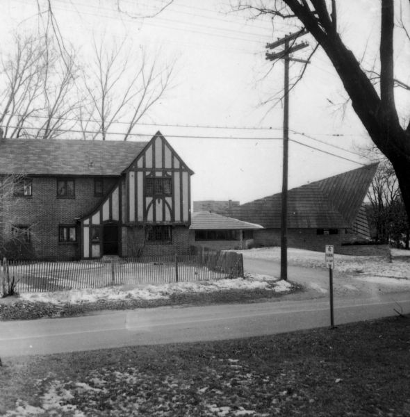 Exterior view of the Frank Lloyd Wright-designed Unitarian Meeting House showing the parsonage on University Bay Drive beside the church.