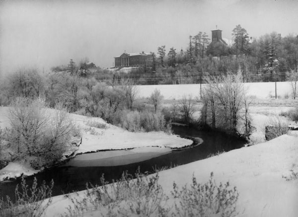 Duncan Creek with McDonnell High School and a church in the background.