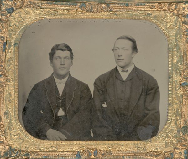 Sixth plate ferrotype/tintype, waist-up portrait of Oluf Ammundson and August Sweger.