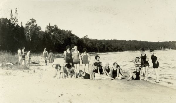 Women employees of Thordarson? in bathing suits on the beach during the First Girls Party to Rock Island.
