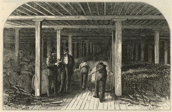 Etching of interior of bonded warehouse with four men present, two conversing and two rolling barrels.