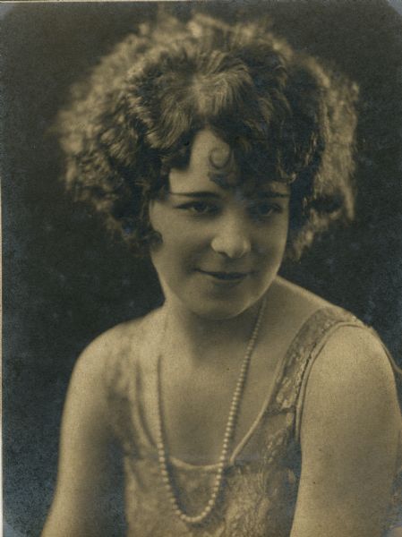A portrait of a young woman with pearls.