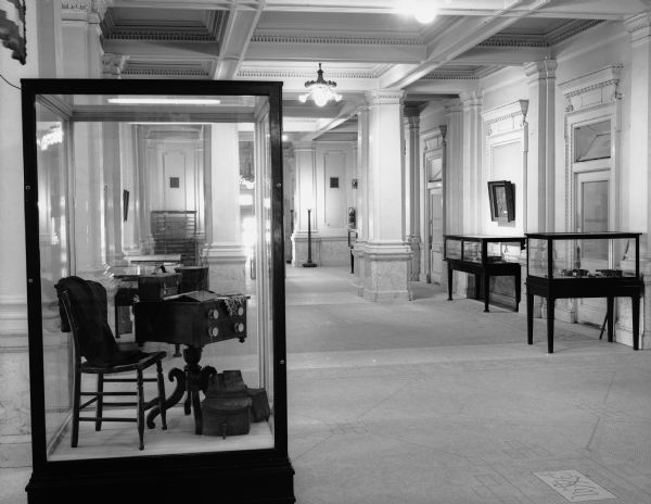 Interior view of the Wisconsin State Historical Society during an exhibit of furniture.