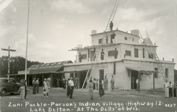 Exterior view of Parson's Indian Village, a tourist attraction on Highway 12 styled after a Zuni pueblo. Caption reads: "Zuni Pueblo-Parson's Indian Village — Highway 12 — Lake Delton — 'At The Dells' of Wis."