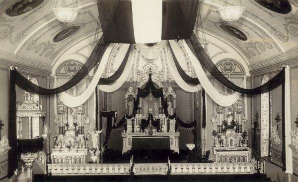 Interior view of the Holy Redeemer Church, also called the "German Catholic" church, decorated for Father Dreis's funeral.