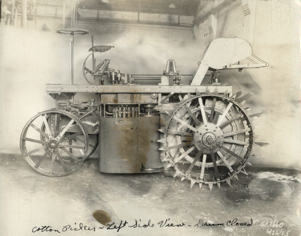 Engineering photograph of an experimental pneumatic spindle cotton picker with its drum closed.