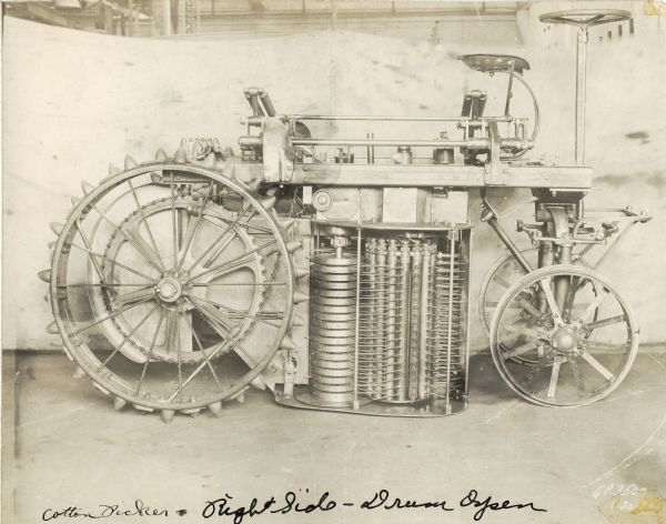 Engineering photograph of an experimental pneumatic spindle cotton picker with the drum open.