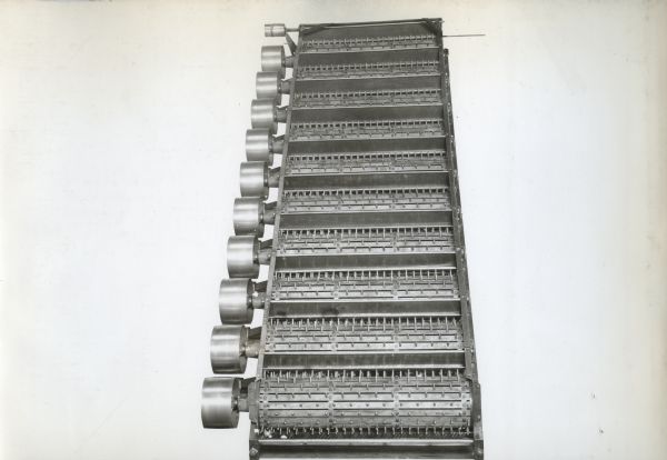 Engineering photograph of the upper rollers and grids of an experimental cotton cleaner.