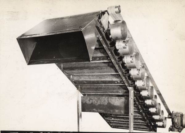Engineering photograph of cleaner rollers and bottom grids for use in a portable cotton cleaner on an experimental cotton picker.