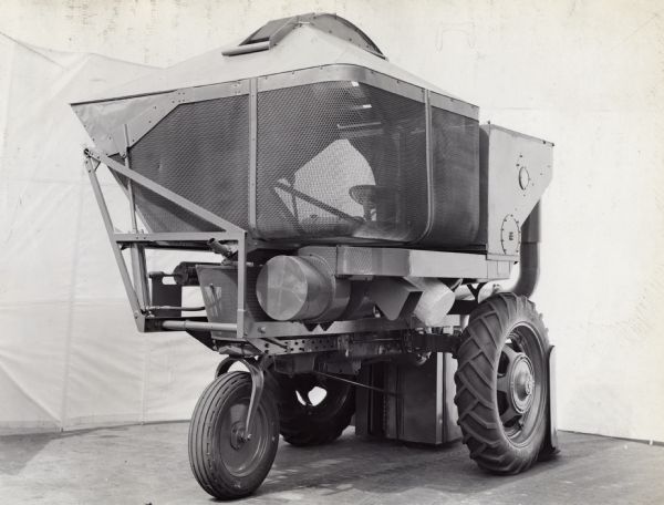 Engineering photograph of the rear and right side of an experimental cotton harvester [picker].