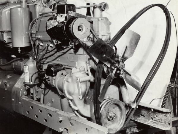 Engineering photograph of cotton harvester [picker] assemblies on a Farmall H tractor fan drive and generator drive.